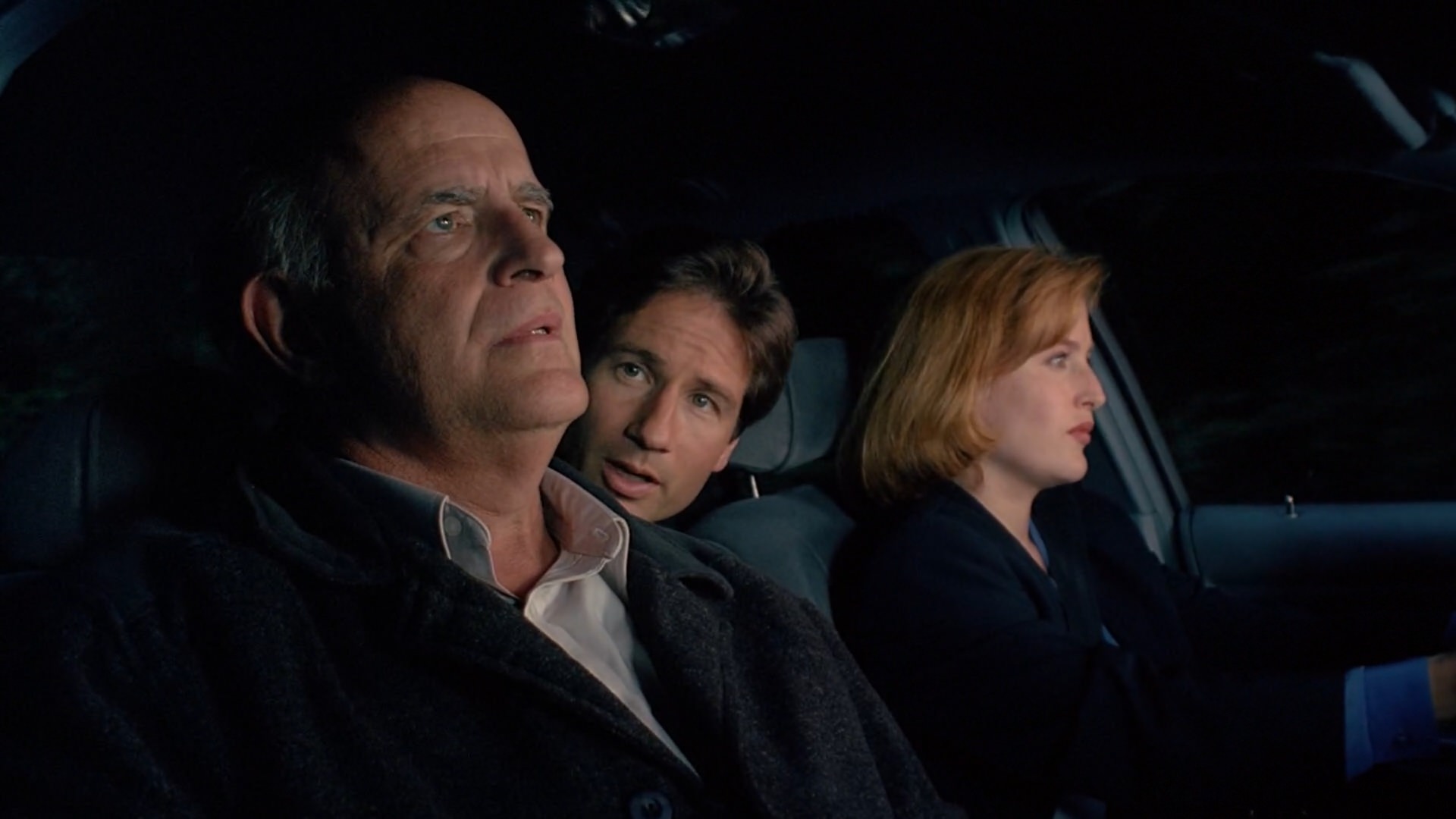 Peter Boyle as Clyde Bruckman fox mulder dana scully in a car x-files