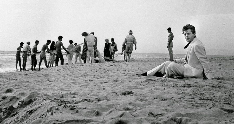 La dolce vita marcello mastroianni sitting in the sand