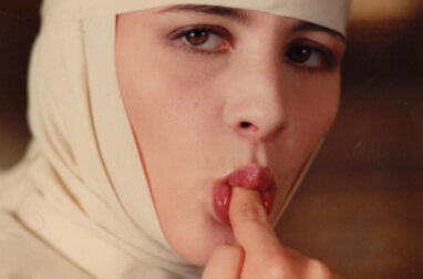 behind convent walls nun licking a finger