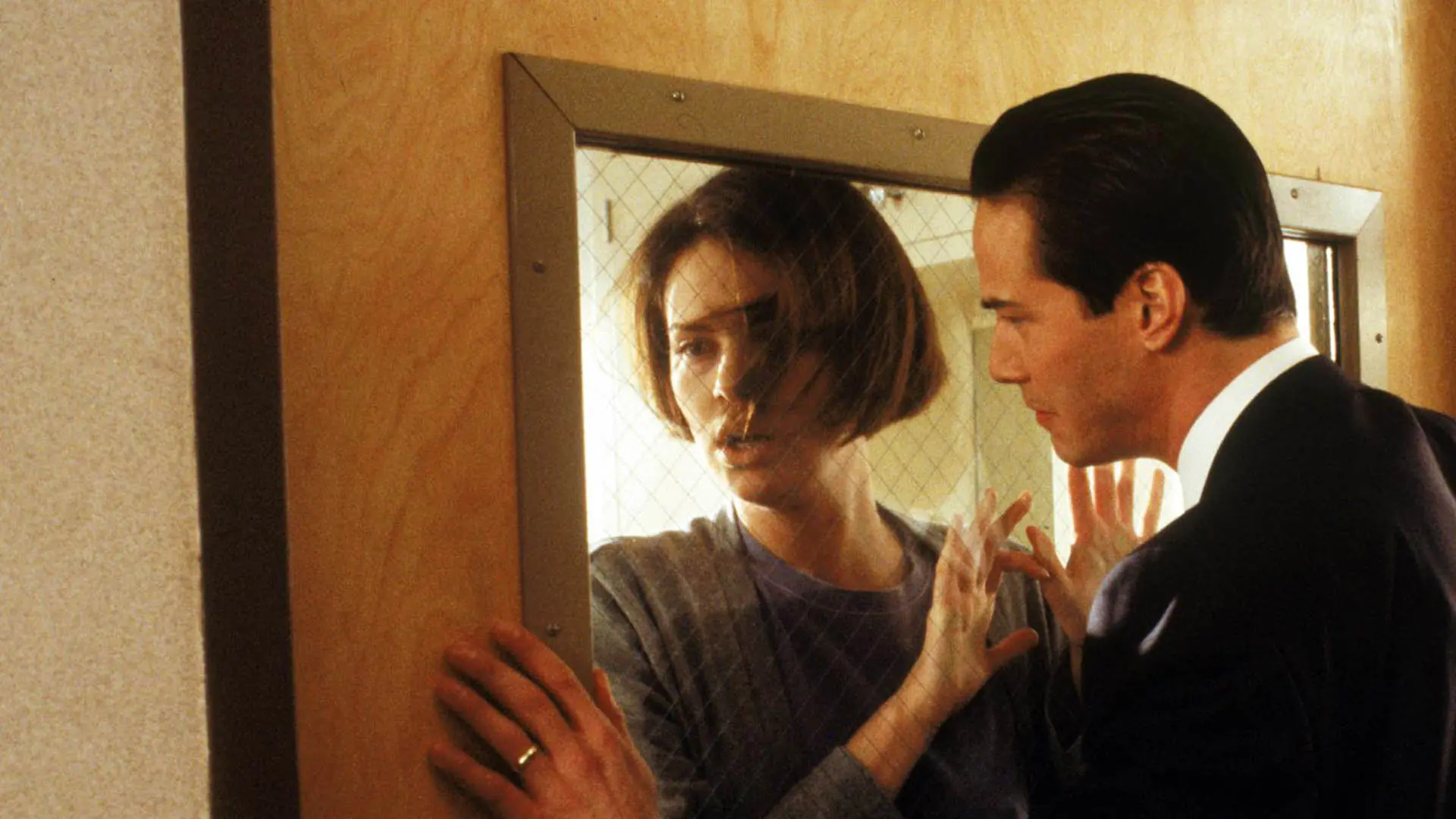 The Devil's Advocate Keanu Reeves as Kevin Lomax and Charlize Theron as Mary Ann Lomax