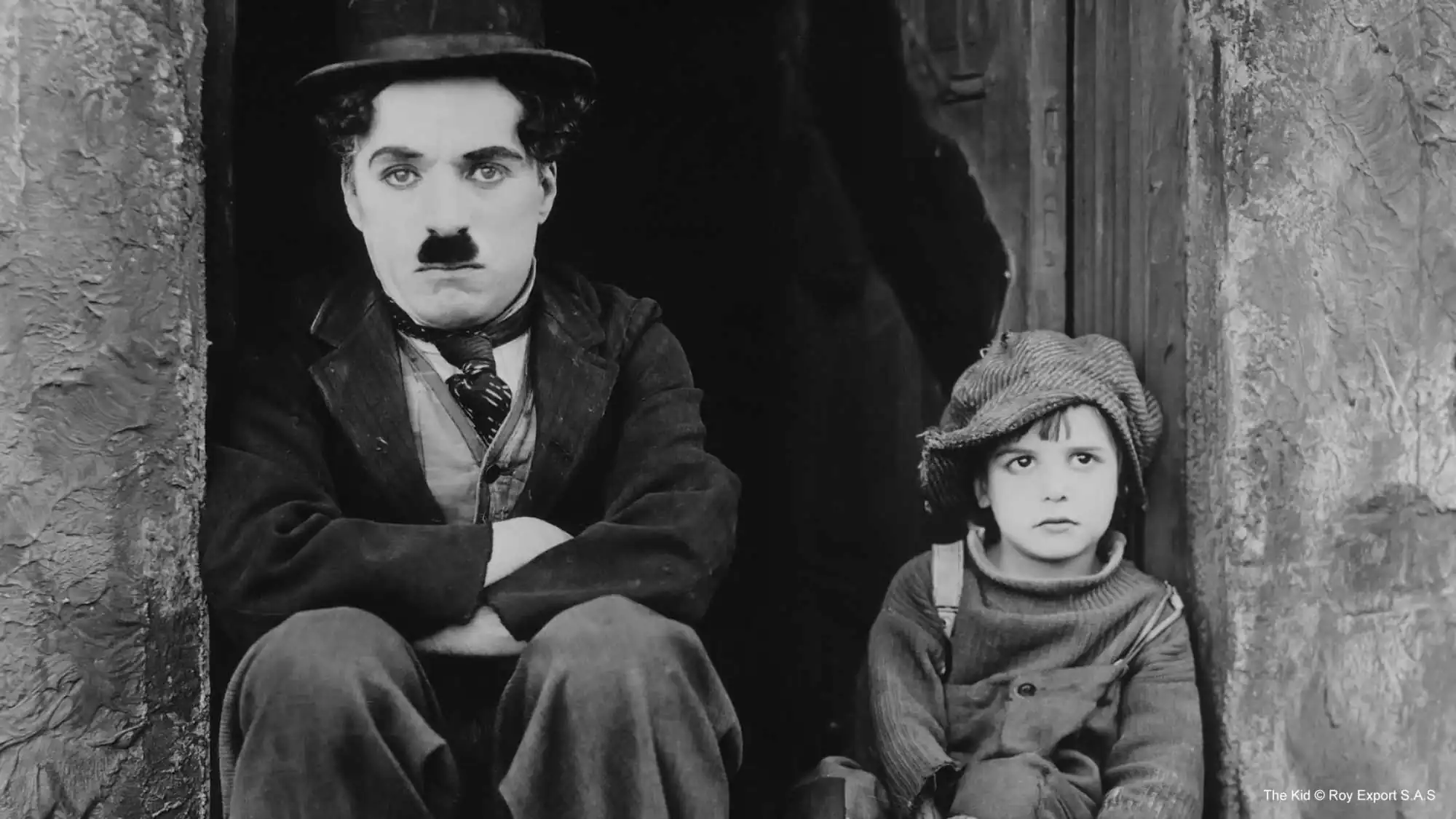 Charlie Chaplin and Jackie Coogan in The Kid