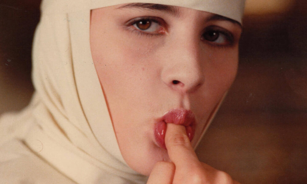 behind convent walls nun licking a finger