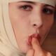 behind convent walls nun licking a finger