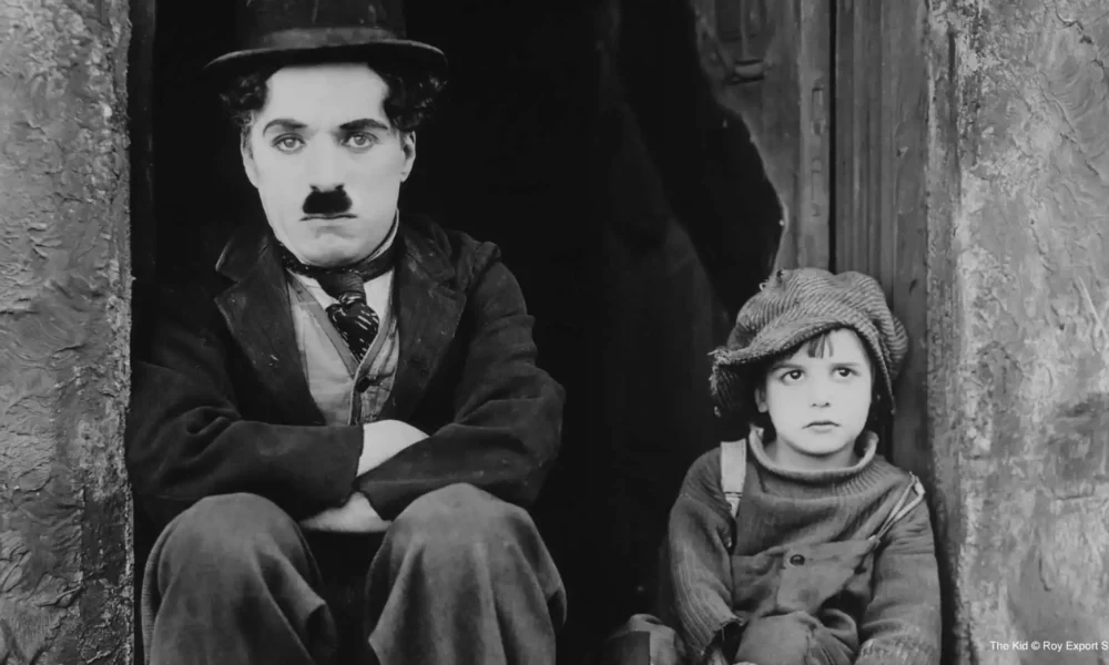 Charlie Chaplin and Jackie Coogan in The Kid