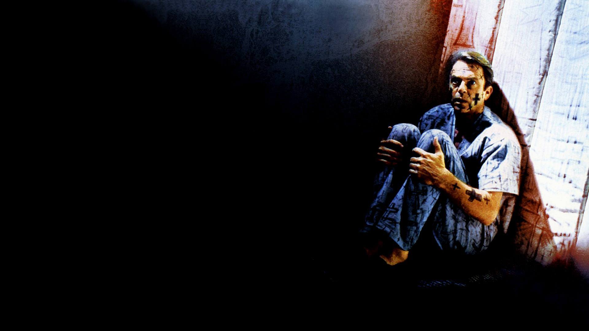 In the Mouth of Madness sam neill in an asylum